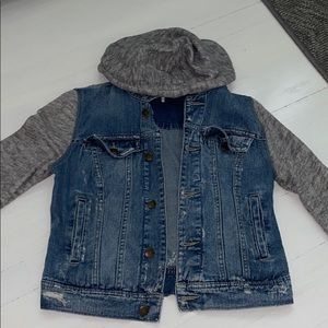 Free people denim jacket with sweatshirt sleeves.